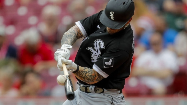 May 7, 2023; Cincinnati, Ohio, USA; Chicago White Sox designated hitter Yasmani Grandal (24) hits a single in the second inning against the Cincinnati Reds at Great American Ball Park. Mandatory Credit: Katie Stratman-USA TODAY Sports
