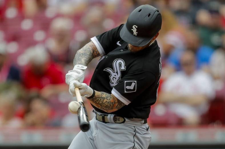 May 7, 2023; Cincinnati, Ohio, USA; Chicago White Sox designated hitter Yasmani Grandal (24) hits a single in the second inning against the Cincinnati Reds at Great American Ball Park. Mandatory Credit: Katie Stratman-USA TODAY Sports