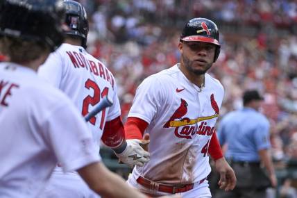 May 7, 2023; St. Louis, Missouri, USA;  St. Louis Cardinals designated hitter Willson Contreras (40) is congratulated by right fielder Lars Nootbaar (21) after scoring against the Detroit Tigers during the second inning at Busch Stadium. Mandatory Credit: Jeff Curry-USA TODAY Sports
