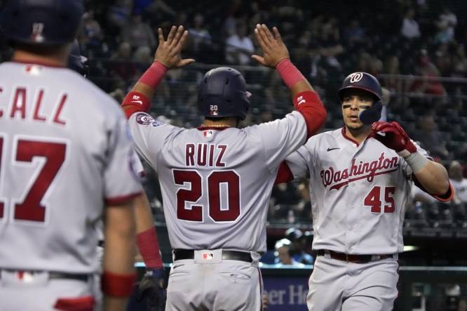 May 3 2022: Washington catcher Keibert Ruiz (20) gets a hit during the game  with Washington