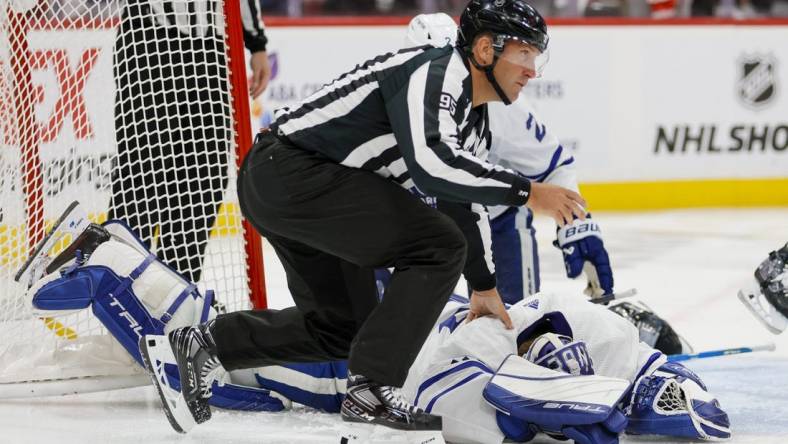 May 7, 2023; Sunrise, Florida, USA; Linesman Jonny Murray (95) checks on Toronto Maple Leafs goaltender Ilya Samsonov (35) after a collision during the second period against the Florida Panthers in game three of the second round of the 2023 Stanley Cup Playoffs at FLA Live Arena. Mandatory Credit: Sam Navarro-USA TODAY Sports