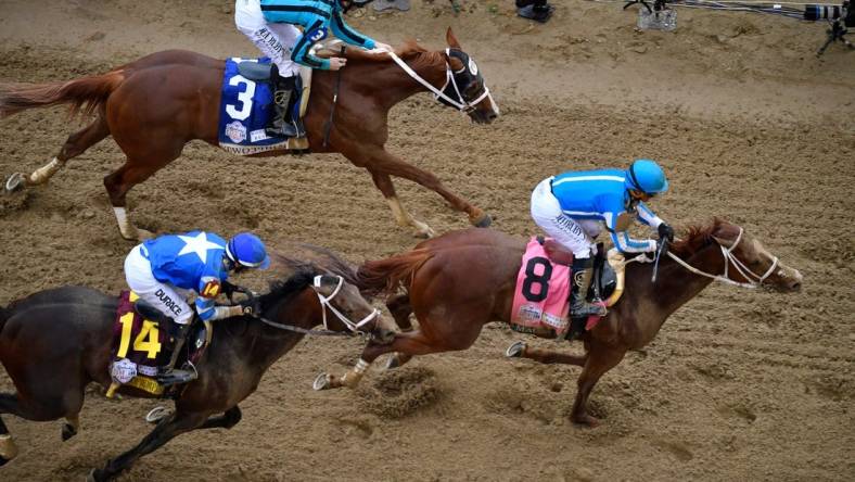 Mage, with Javier Castellano up (8) leads Two Phil's, with Jareth Loveberry up (3) and Angel of Empire, with Flavien Prat up across the line to win the 147th running of The Kentucky Derby, Saturday, May 6, 2023 in Louisville, Ky.