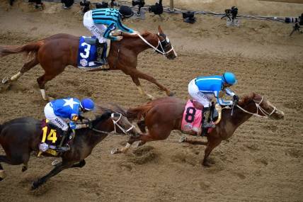 Mage, with Javier Castellano up (8) leads Two Phil's, with Jareth Loveberry up (3) and Angel of Empire, with Flavien Prat up across the line to win the 147th running of The Kentucky Derby, Saturday, May 6, 2023 in Louisville, Ky.