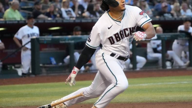 Arizona Diamondbacks    Alek Thomas (5) hits a triple against the Washington Nationals at Chase Field on May 6, 2023.