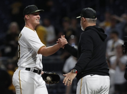 May 8, 2023; Pittsburgh, Pennsylvania, USA;  Pittsburgh Pirates starting pitcher Mitch Keller (23) is congratulated by manager Derek Shelton (right) after Keller pitched a complete game four hit shutout against the Colorado Rockies at PNC Park. The Pirates shutout the Rockies 2-0. Mandatory Credit: Charles LeClaire-USA TODAY Sports