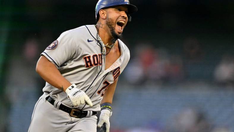 May 8, 2023; Anaheim, California, USA;  Houston Astros first baseman Jose Abreu (79) smiles as he advances to third on a fielding error by Los Angeles Angels right fielder Hunter Renfroe (12) in the third inning at Angel Stadium. Mandatory Credit: Jayne Kamin-Oncea-USA TODAY Sports