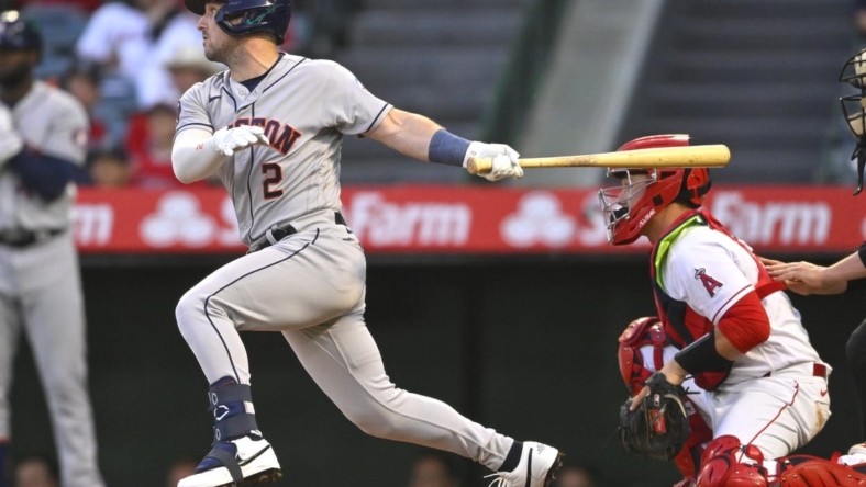 May 8, 2023; Anaheim, California, USA;  Houston Astros third baseman Alex Bregman (2) hits a RBI triple in the third inning against the Los Angeles Angels at Angel Stadium. Mandatory Credit: Jayne Kamin-Oncea-USA TODAY Sports