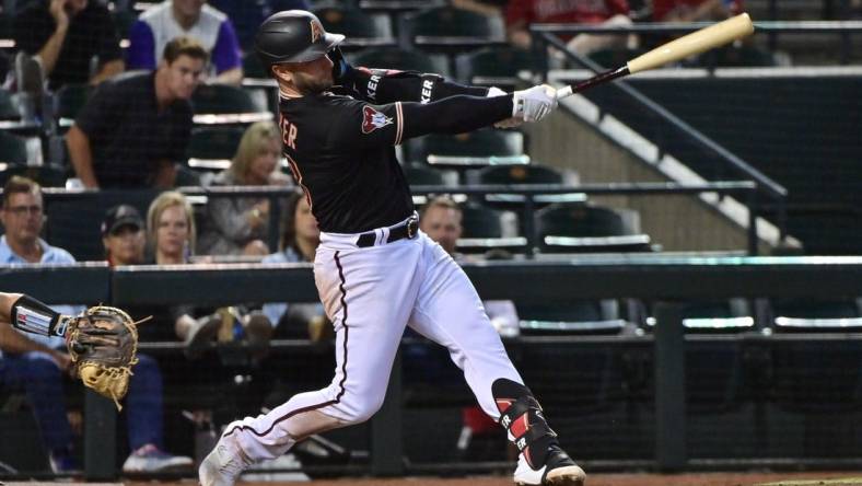 May 8, 2023; Phoenix, Arizona, USA;  Arizona Diamondbacks first baseman Christian Walker (53) hits a solo home run in the sixth inning against the Miami Marlins at Chase Field. Mandatory Credit: Matt Kartozian-USA TODAY Sports