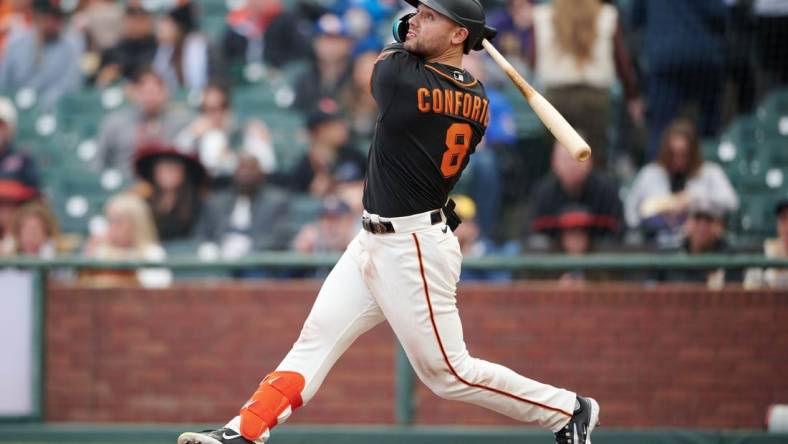 May 6, 2023; San Francisco, California, USA; San Francisco Giants outfielder Michael Conforto (8) bats against the Milwaukee Brewers during the seventh inning at Oracle Park. Mandatory Credit: Robert Edwards-USA TODAY Sports