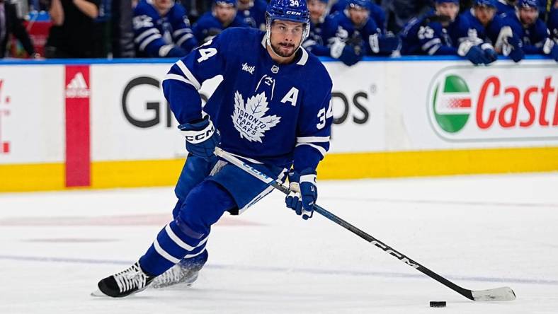 May 4, 2023; Toronto, Ontario, CANADA; Toronto Maple Leafs forward Auston Matthews (34) controls the puck against the Florida Panthers during game two of the second round of the 2023 Stanley Cup Playoffs at Scotiabank Arena. Mandatory Credit: John E. Sokolowski-USA TODAY Sports