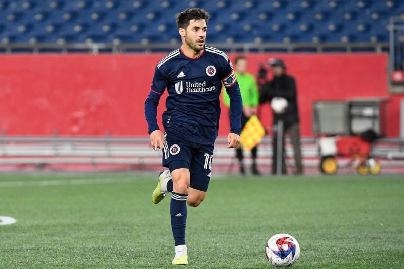 May 9, 2023; Foxborough, MA, USA; New England Revolution midfielder Carles Gil (10) dribbles the ball during the second half at Gillette Stadium. Mandatory Credit: Eric Canha-USA TODAY Sports