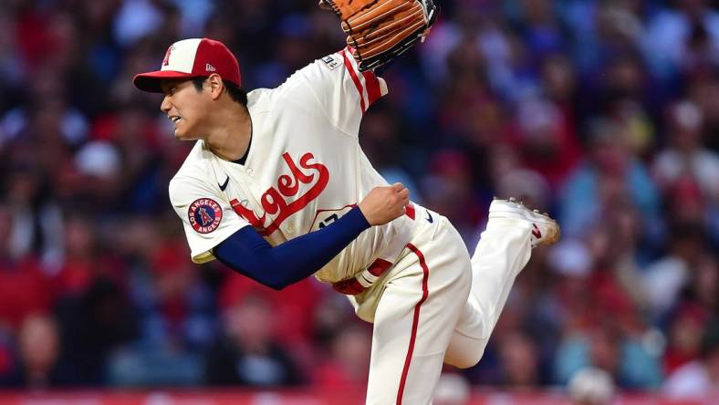 May 9, 2023; Anaheim, California, USA; Los Angeles Angels starting pitcher Shohei Ohtani (17) throws against the Houston Astros during the fourth inning at Angel Stadium. Mandatory Credit: Gary A. Vasquez-USA TODAY Sports