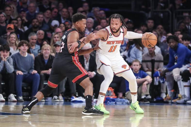 May 10, 2023; New York, New York, USA; New York Knicks guard Jalen Brunson (11) looks to drive past Miami Heat guard Kyle Lowry (7) during game five of the 2023 NBA playoffs at Madison Square Garden. Mandatory Credit: Wendell Cruz-USA TODAY Sports