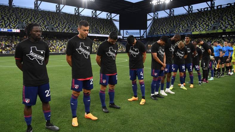 May 10, 2023; Nashville, TN, USA; FC Dallas players observe a moment of silence for the shooting victims of Allen, TX over the weekend before the match against the Nashville SC at GEODIS Park. Mandatory Credit: Christopher Hanewinckel-USA TODAY Sports