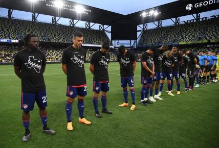 May 10, 2023; Nashville, TN, USA; FC Dallas players observe a moment of silence for the shooting victims of Allen, TX over the weekend before the match against the Nashville SC at GEODIS Park. Mandatory Credit: Christopher Hanewinckel-USA TODAY Sports