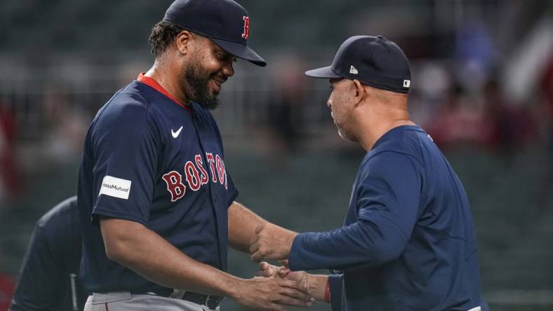 May 10, 2023; Cumberland, Georgia, USA; Boston Red Sox relief pitcher Kenley Jansen (74) reacts with manager Alex Cora (13) after recording his 400th career save against the Atlanta Braves at Truist Park. Mandatory Credit: Dale Zanine-USA TODAY Sports