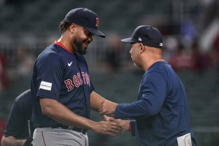May 10, 2023; Cumberland, Georgia, USA; Boston Red Sox relief pitcher Kenley Jansen (74) reacts with manager Alex Cora (13) after recording his 400th career save against the Atlanta Braves at Truist Park. Mandatory Credit: Dale Zanine-USA TODAY Sports