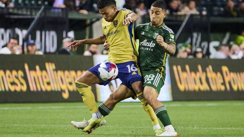 May 10, 2023; Portland, OR, USA; Real Salt Lake midfielder Maikel Chang (16) controls the ball during the second half against Portland Timbers defender Pablo Bonilla (28) at Providence Park. Mandatory Credit: Troy Wayrynen-USA TODAY Sports