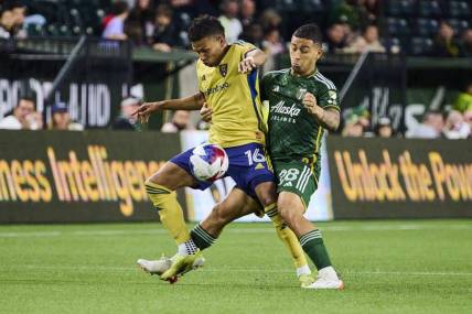 May 10, 2023; Portland, OR, USA; Real Salt Lake midfielder Maikel Chang (16) controls the ball during the second half against Portland Timbers defender Pablo Bonilla (28) at Providence Park. Mandatory Credit: Troy Wayrynen-USA TODAY Sports