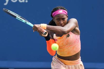 Coco Gauff returns the ball to Marle Bouzkova during their match on the Grand Stand court at the 2022 Western & Southern Open on Tuesday August 16. Gauff forfeit during the second set after receiving an injury.