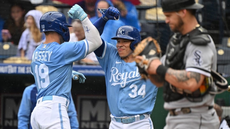 May 11, 2023; Kansas City, Missouri, USA;  Kansas City Royals second baseman Michael Massey (19) celebrates with catcher Freddy Fermin (34) after hitting a solo home run during the second inning against the Chicago White Sox at Kauffman Stadium. Mandatory Credit: Peter Aiken-USA TODAY Sports