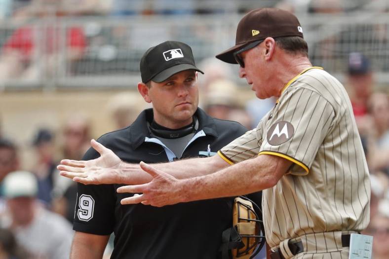 May 11, 2023; Minneapolis, Minnesota, USA; San Diego Padres manager Bob Melvin speaks with home plate umpire Brock Ballou in the eighth inning of the game with the Minnesota Twins at Target Field. Mandatory Credit: Bruce Kluckhohn-USA TODAY Sports