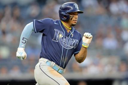 May 11, 2023; Bronx, New York, USA; Tampa Bay Rays shortstop Wander Franco (5) runs to first after hitting a single against the New York Yankees during the third inning at Yankee Stadium. Mandatory Credit: Brad Penner-USA TODAY Sports