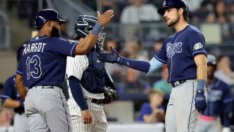 May 11, 2023; Bronx, New York, USA; Tampa Bay Rays right fielder Josh Lowe (15) celebrates his two run home run against the New York Yankees with center fielder Manuel Margot (13) during the eighth inning at Yankee Stadium. Mandatory Credit: Brad Penner-USA TODAY Sports