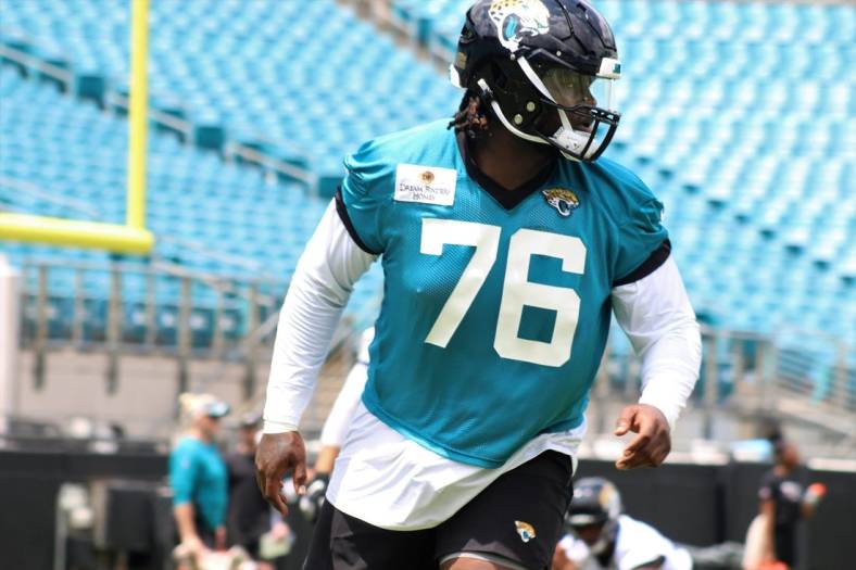 Offensive lineman Anton Harrison stretches during the 2023 Jaguars Rookie Minicamp held at TIAA Bank Field.
