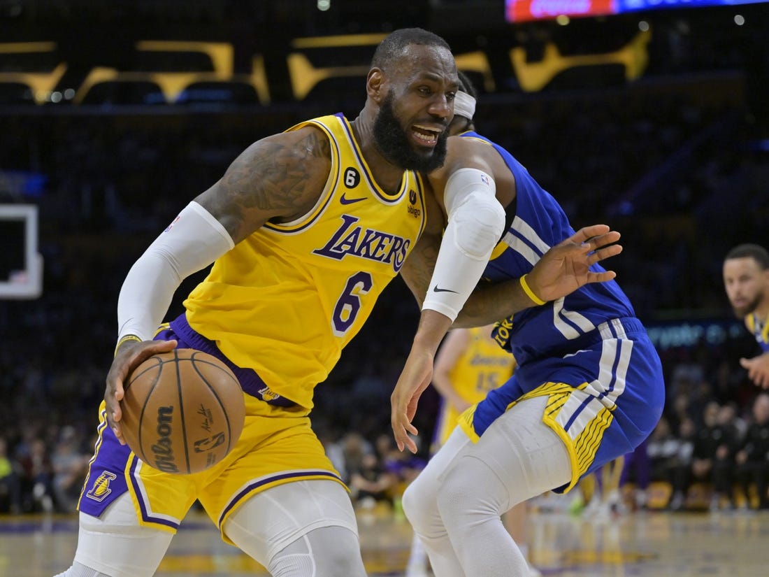 May 12, 2023; Los Angeles, California, USA; Los Angeles Lakers forward LeBron James (6) is defended by Golden State Warriors guard Moses Moody (4) as he drives to the basket in the first half of game six of the 2023 NBA playoffs at Crypto.com Arena. Mandatory Credit: Jayne Kamin-Oncea-USA TODAY Sports