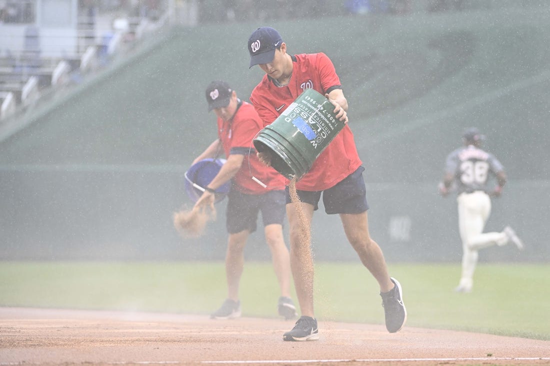 May 13, 2023; Washington, District of Columbia, USA; Washington Nationals grounds crew speeds field conditioner before the third inning of the game between the Washington Nationals and the New York Mets at Nationals Park. Mandatory Credit: Brad Mills-USA TODAY Sports