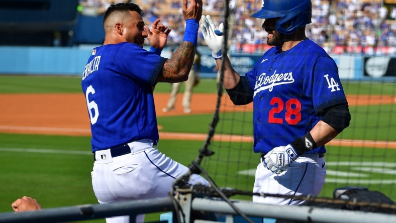 May 13, 2023; Los Angeles, California, USA; Los Angeles Dodgers designated hitter J.D. Martinez (28) is greeted by left fielder David Peralta (6) after hitting a three run home run against the San Diego Padres during the first inning at Dodger Stadium. Mandatory Credit: Gary A. Vasquez-USA TODAY Sports