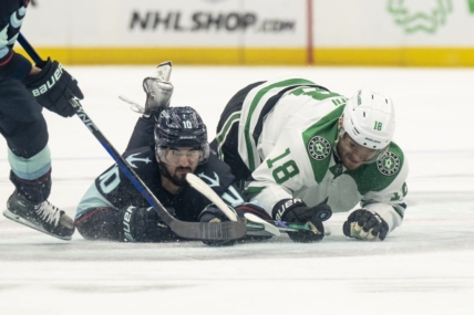 May 13, 2023; Seattle, Washington, USA; Seattle Kraken forward Matty Beniers (10) and Dallas Stars forward Max Domi (18) dive for a loose puck during the second period in game six of the second round of the 2023 Stanley Cup Playoffs at Climate Pledge Arena. Mandatory Credit: Stephen Brashear-USA TODAY Sports