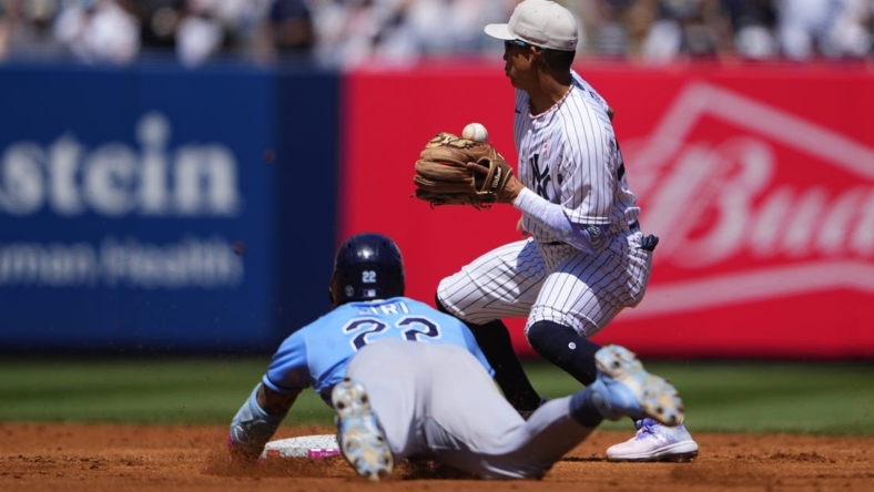 May 14, 2023; Bronx, New York, USA; Tampa Bay Rays center fielder Jose Siri (22) slides safely into second base with a double with New York Yankees second baseman Oswaldo Cabrera (95) receiving the throw during the third inning at Yankee Stadium. Mandatory Credit: Gregory Fisher-USA TODAY Sports