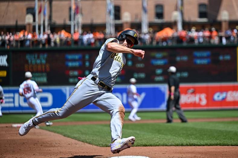 May 14, 2023; Baltimore, Maryland, USA; Pittsburgh Pirates left fielder Bryan Reynolds (10) rounds third base to score during the third inning against the Baltimore Orioles at Oriole Park at Camden Yards. Mandatory Credit: Reggie Hildred-USA TODAY Sports
