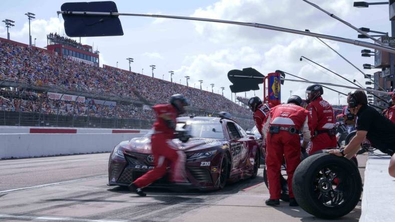 May 14, 2023; Darlington, South Carolina, USA; NASCAR Cup Series driver Bubba Wallace (23) gets service at Darlington Raceway. Mandatory Credit: David Yeazell-USA TODAY Sports