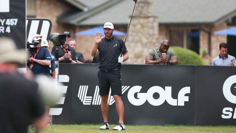 May 14, 2023; Tulsa, Oklahoma, USA; Dustin Johnson waves to the crowd on the opening tee during the final round of a LIV Golf event at Cedar Ridge Country Club. Mandatory Credit: Joey Johnson-USA TODAY Sports