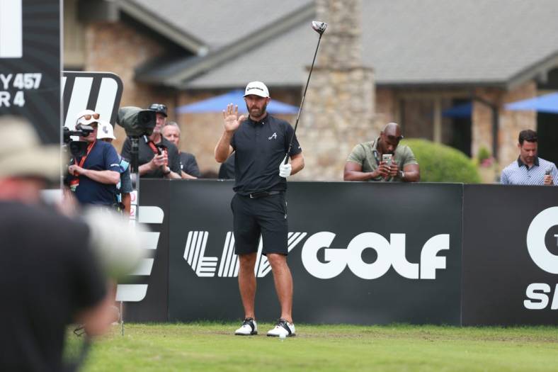May 14, 2023; Tulsa, Oklahoma, USA; Dustin Johnson waves to the crowd on the opening tee during the final round of a LIV Golf event at Cedar Ridge Country Club. Mandatory Credit: Joey Johnson-USA TODAY Sports