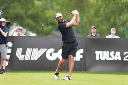 May 14, 2023; Tulsa, Oklahoma, USA; Dustin Johnson watches his tee shot during the final round of a LIV Golf event at Cedar Ridge Country Club. Mandatory Credit: Joey Johnson-USA TODAY Sports