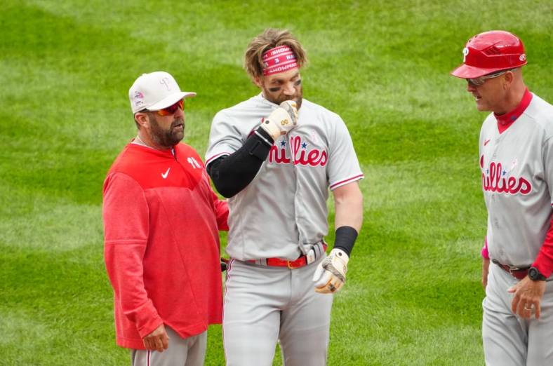 May 14, 2023; Denver, Colorado, USA; Philadelphia Phillies designated hitter Bryce Harper (3) following a scrum on the field in the seventh inning against the Colorado Rockies at Coors Field. Mandatory Credit: Ron Chenoy-USA TODAY Sports