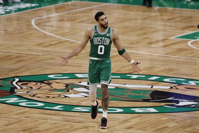 May 14, 2023; Boston, Massachusetts, USA; Boston Celtics forward Jayson Tatum (0) celebrates after making a three point basket against the Philadelphia 76ers during the second half of game seven of the 2023 NBA playoffs at TD Garden. Mandatory Credit: Winslow Townson-USA TODAY Sports