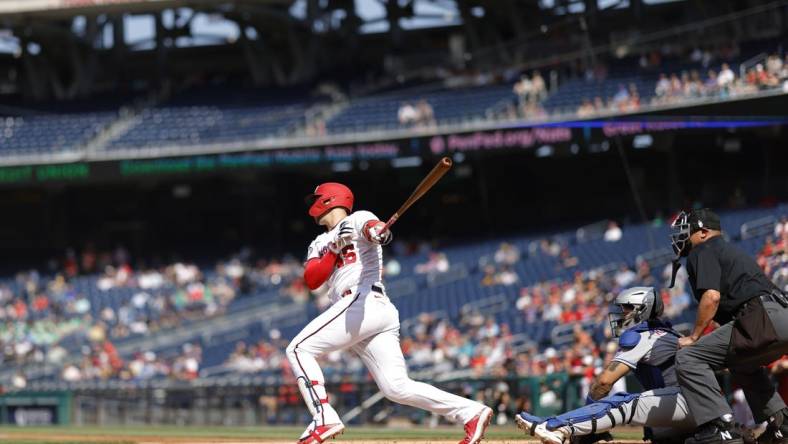 May 15, 2023; Washington, District of Columbia, USA; Washington Nationals designated hitter Joey Meneses (45) hits an RBI double against the New York Mets during the first inning at Nationals Park. Mandatory Credit: Geoff Burke-USA TODAY Sports