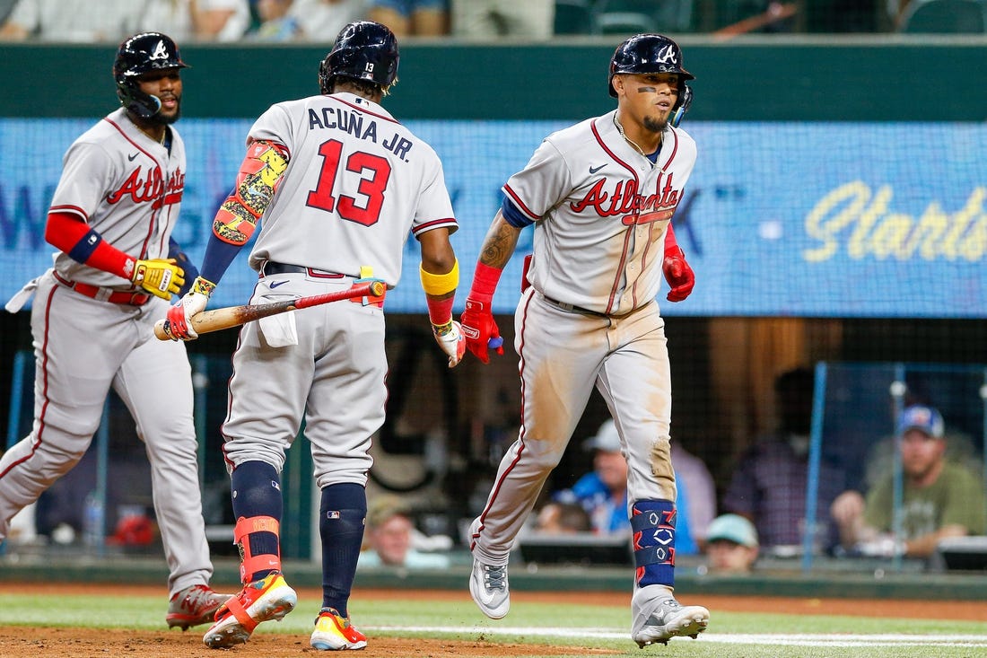 May 15, 2023; Arlington, Texas, USA; Atlanta Braves shortstop Orlando Arcia (11) is congratulated by right fielder Ronald Acuna Jr. (13) after he hits a two-run home run against the Texas Rangers during the sixth inning at Globe Life Field. Mandatory Credit: Andrew Dieb-USA TODAY Sports