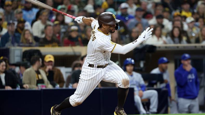 May 15, 2023; San Diego, California, USA;  San Diego Padres shortstop Xander Bogaerts (2) hits a single during the seventh inning against the Kansas City Royals at Petco Park. Mandatory Credit: Kiyoshi Mio-USA TODAY Sports