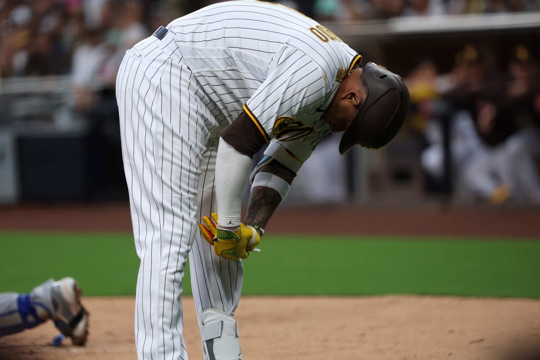 May 15, 2023; San Diego, California, USA;  San Diego Padres third baseman Manny Machado (13) reacts after being hit by a pitch during the second inning against the Kansas City Royals at Petco Park. Mandatory Credit: Kiyoshi Mio-USA TODAY Sports