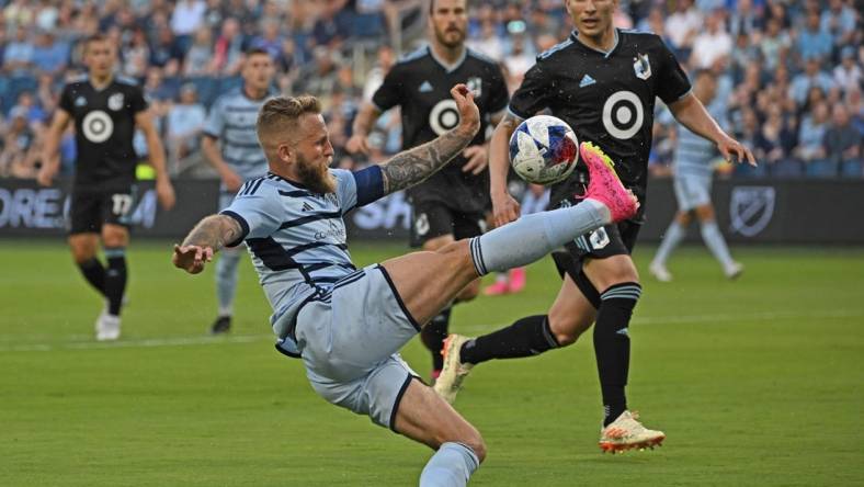 May 13, 2023; Kansas City, Kansas, USA;  Sporting Kansas City forward Johnny Russell (7) makes a play on the ball in the first half against Minnesota United at Children's Mercy Park. Mandatory Credit: Peter Aiken-USA TODAY Sports