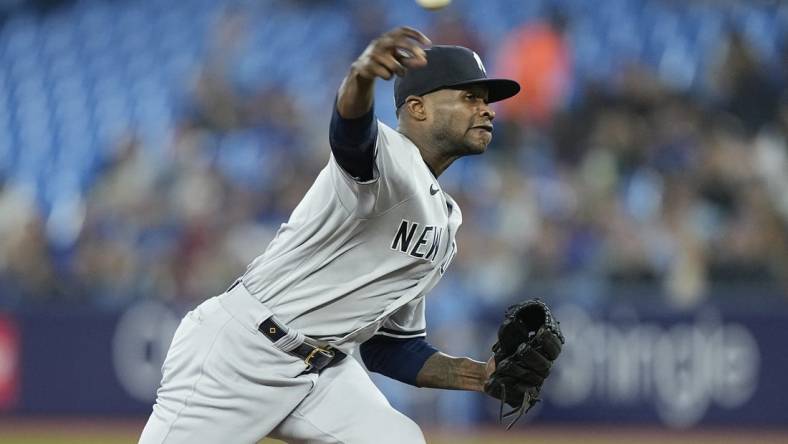 May 16, 2023; Toronto, Ontario, CAN; New York Yankees pitcher Domingo German (0) pitches to the Toronto Blue Jays during the first inning at Rogers Centre. Mandatory Credit: John E. Sokolowski-USA TODAY Sports