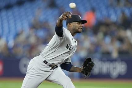 May 16, 2023; Toronto, Ontario, CAN; New York Yankees pitcher Domingo German (0) pitches to the Toronto Blue Jays during the first inning at Rogers Centre. Mandatory Credit: John E. Sokolowski-USA TODAY Sports