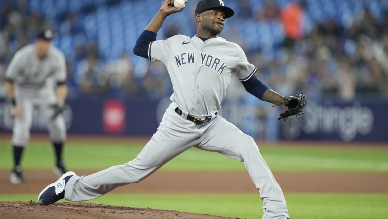 May 16, 2023; Toronto, Ontario, CAN; New York Yankees starting pitcher Domingo German (0) pitches to the Toronto Blue Jays during the first inning at Rogers Centre. Mandatory Credit: John E. Sokolowski-USA TODAY Sports