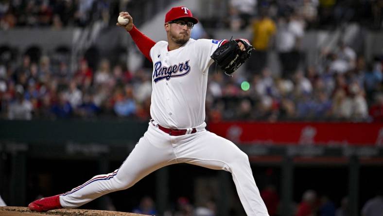 May 16, 2023; Arlington, Texas, USA; Texas Rangers starting pitcher Dane Dunning (33) pitches against the Atlanta Braves during the third inning at Globe Life Field. Mandatory Credit: Jerome Miron-USA TODAY Sports